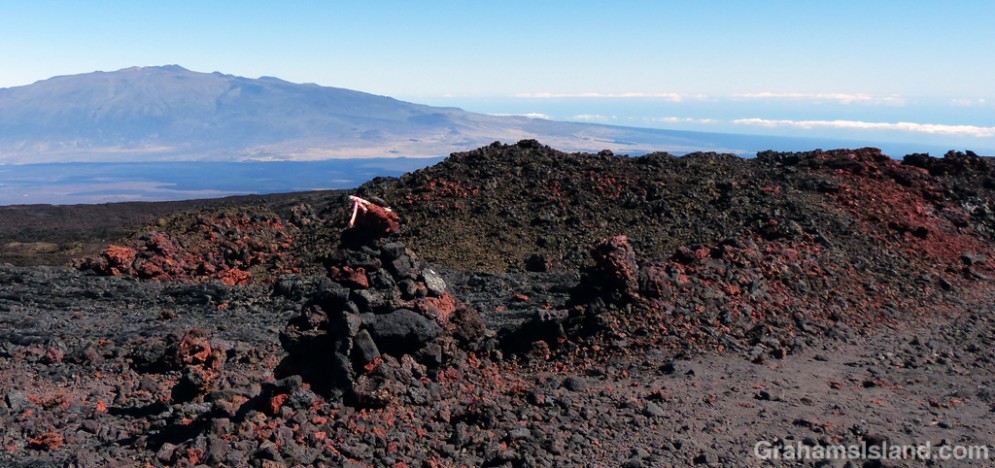The lava comes in many colors, seen here where the trail crosses the road.