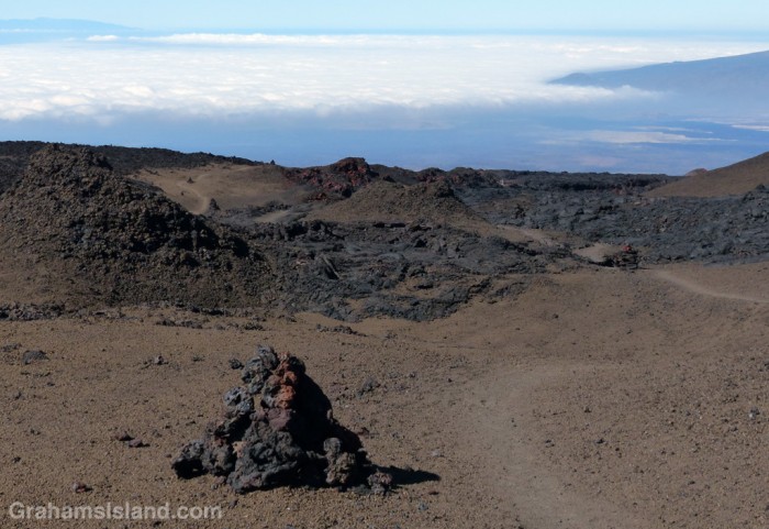 Clouds hang over the west side of the saddle between Mauna Loa and Mauna Kea.