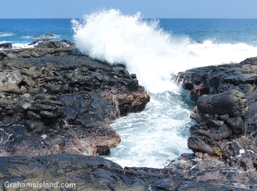 Waves crash ashore near Mano Point