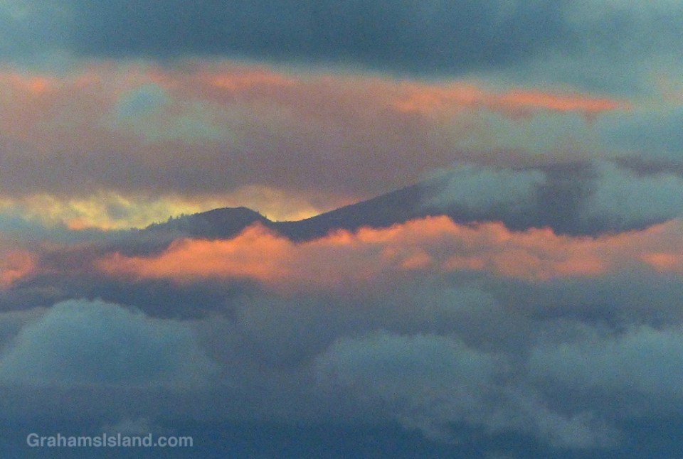 The hills of Maui seen through evening clouds.