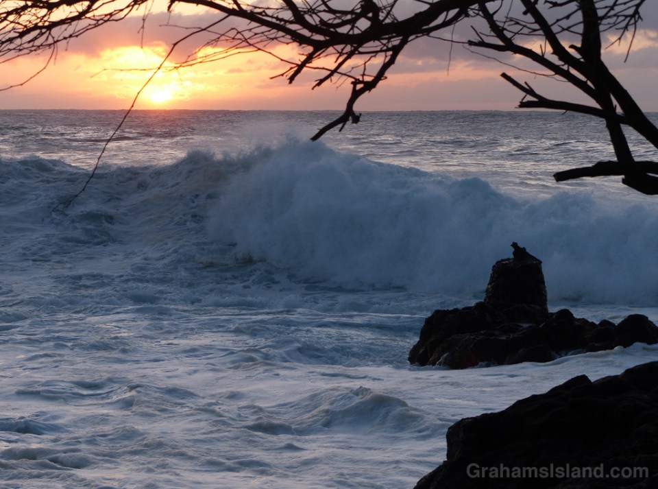 Surf rolls in as the sun sets