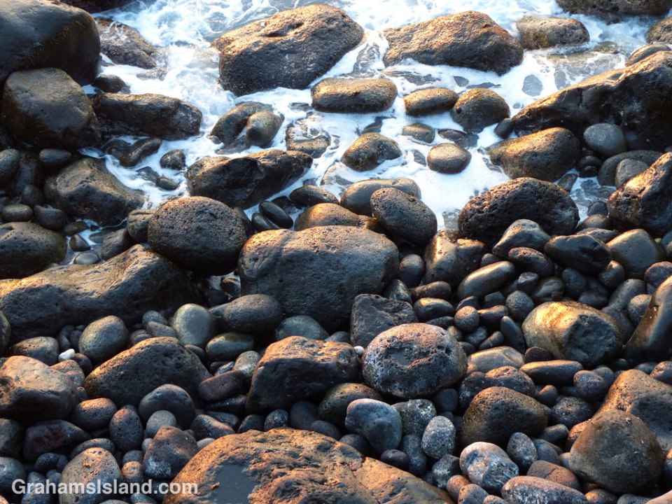 Light reflects off wet rocks