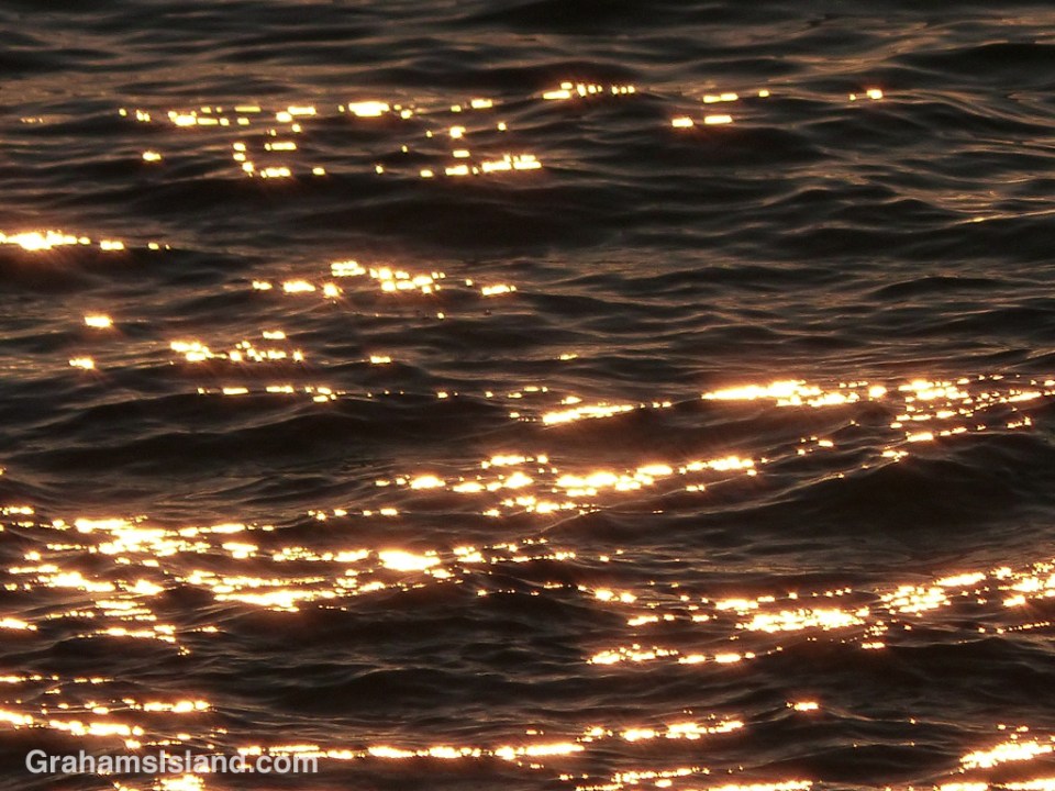 Early evening sun illuminates ripples on the water off the Big Island.