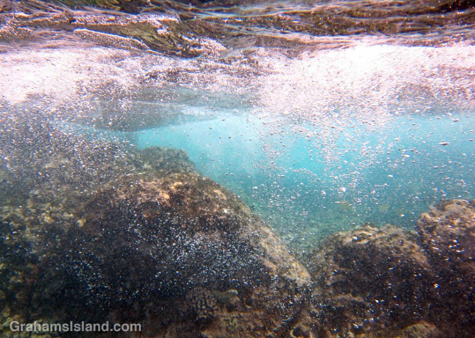 Surging water creates storms of bubbles.