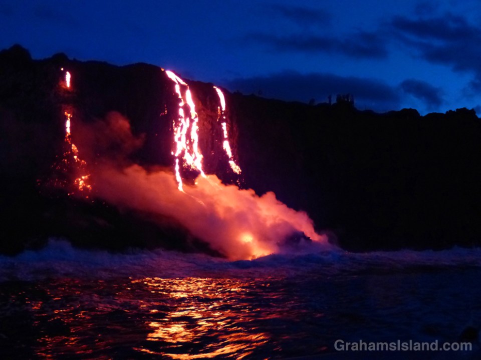 Kilauea lava reaches the ocean in the pre-dawn light.