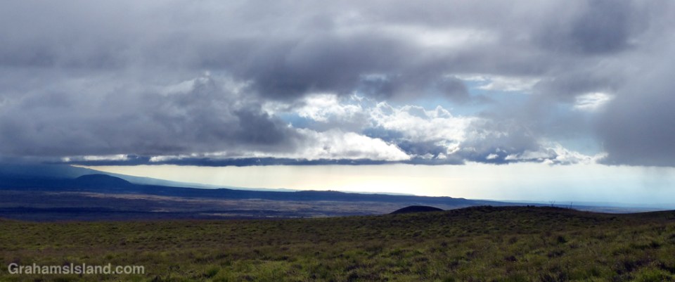 The late afternoon sky from old Saddle Road looking down toward the South Kohala coast.
