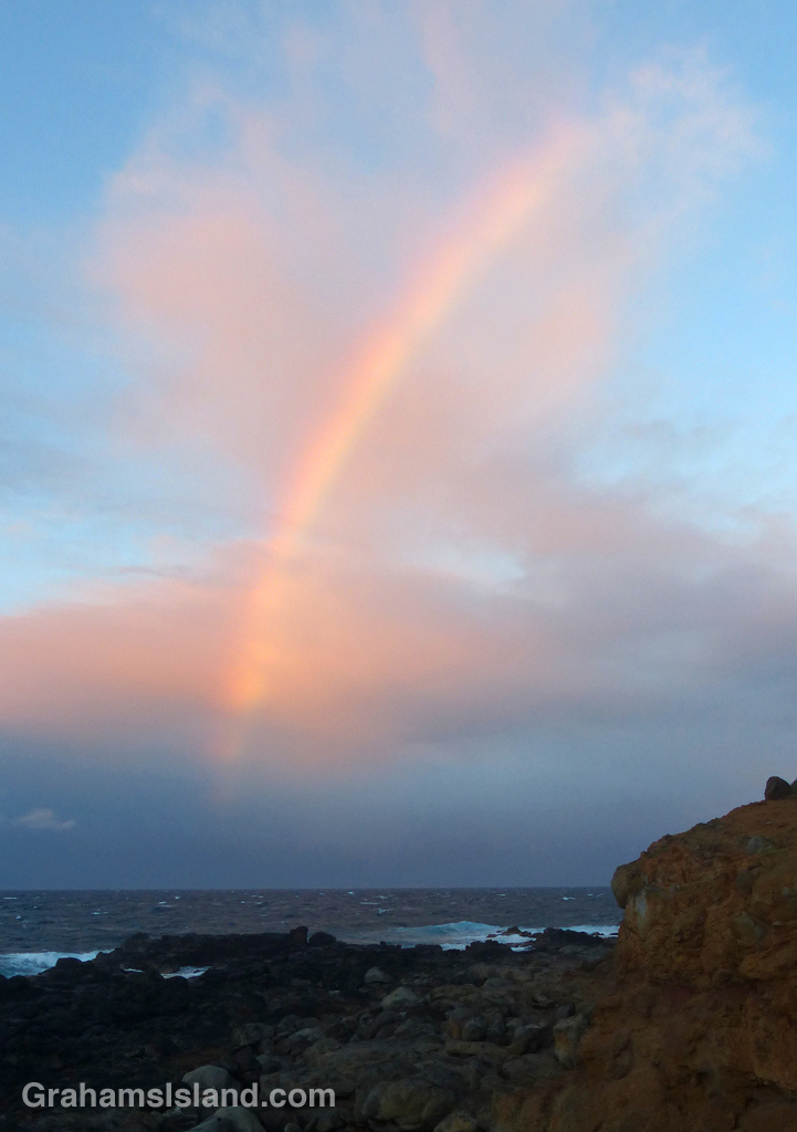 A slice of rainbow, backed by pink clouds