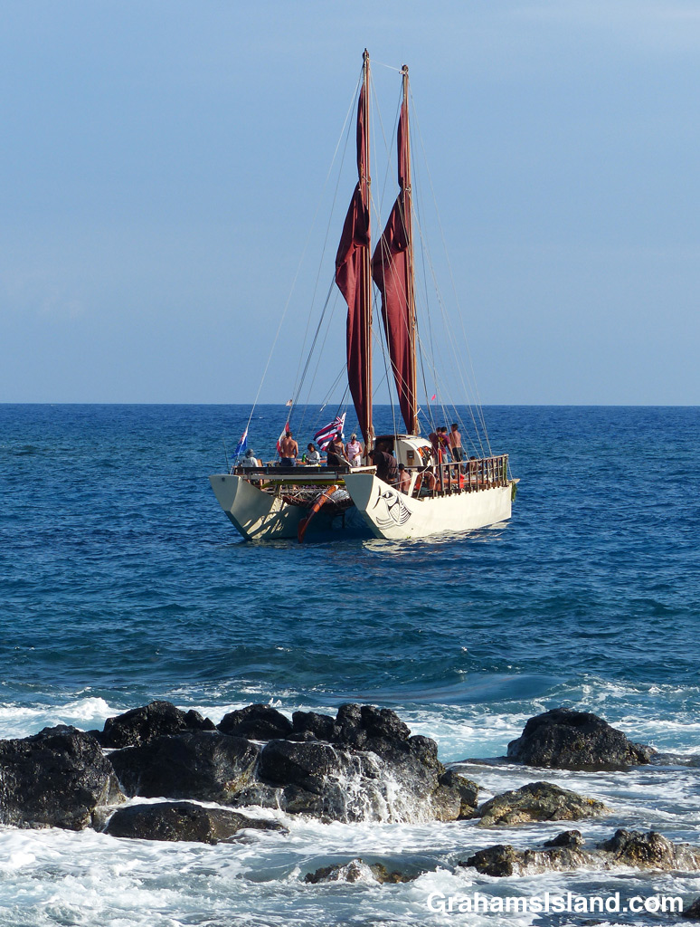 The Tahitian voyaging canoe Fa‘afaite off the coast of the Big Island of Hawaii.