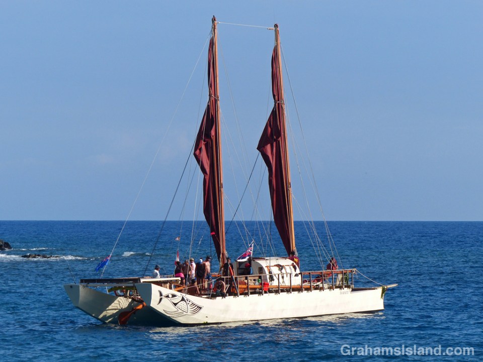 The Tahitian voyaging canoe Fa‘afaite off the coast of the Big Island of Hawaii.