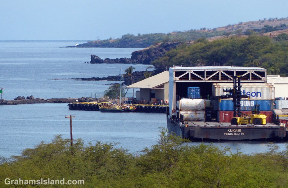 An inter-island barge and Hawaiian voyaging canoe Makali'i at Kawaihae harbor.