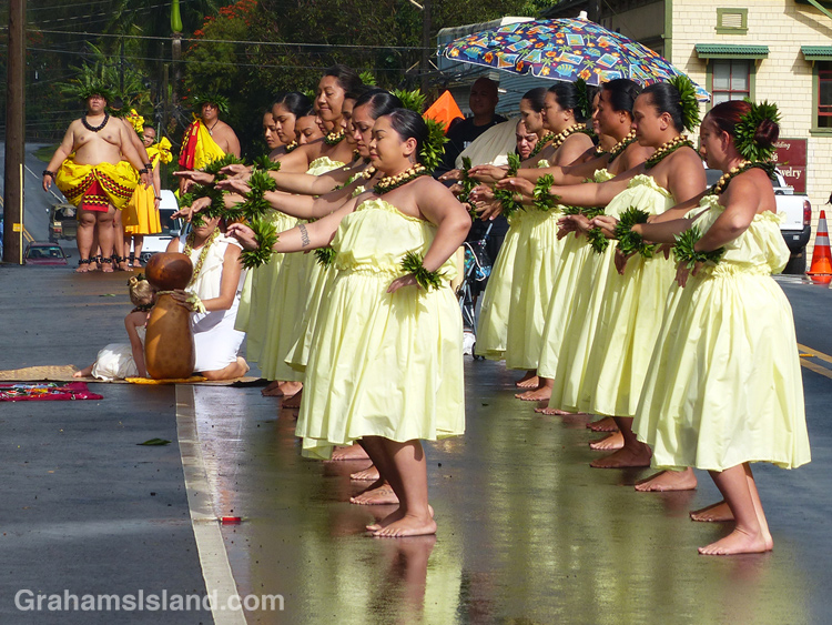 A hula group performs on front of the statue of King Kamehameha 1 in Kapaau