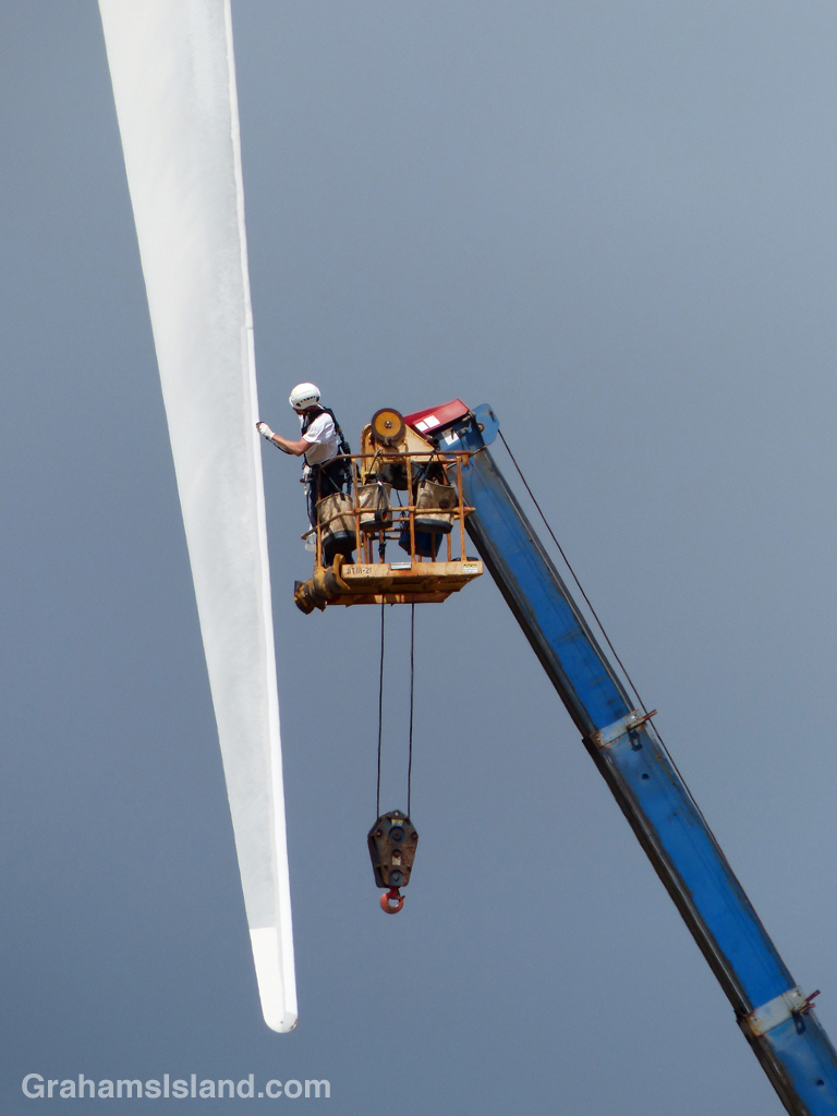 A worker checks out a turbine blade at Hawi Wind Farm.