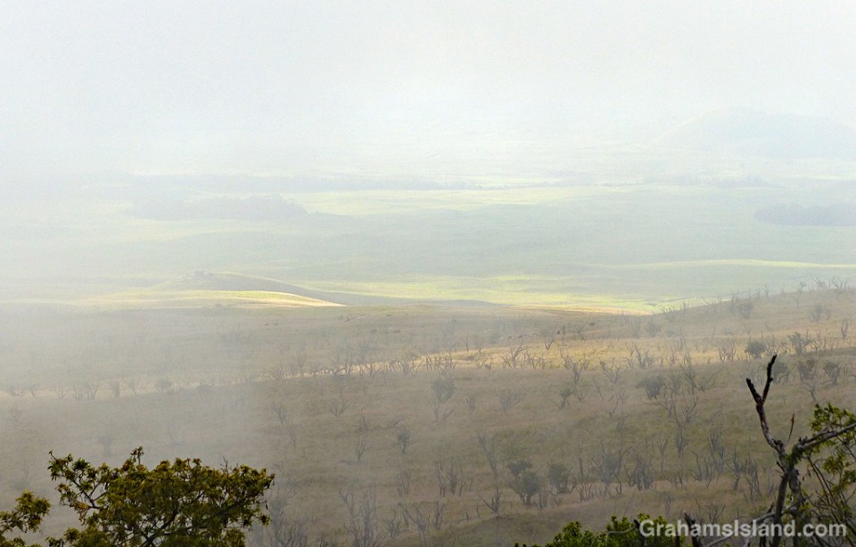Low clouds blanket the lower slope of Mauna Kea.