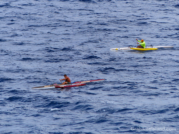 Two outrigger canoes off the coast of Hawaii