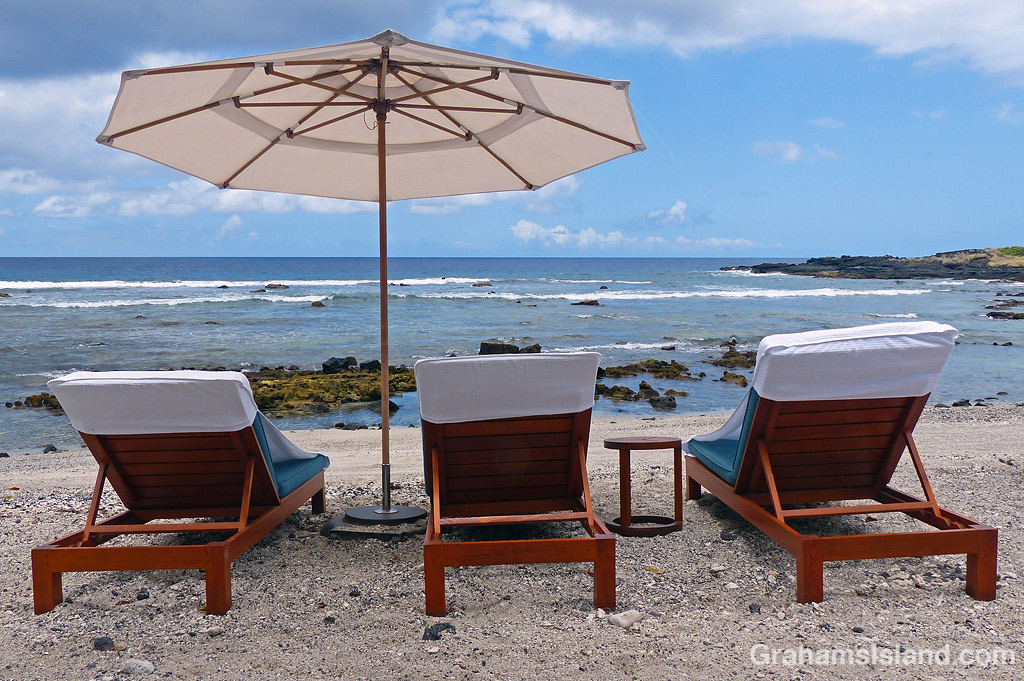 Beach chairs in front of the Kohanaiki Beach Club, Hawaii