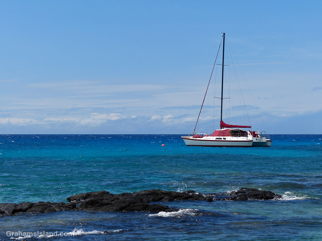 A Sailboat on a mooring buoy in the waters off Hawaii