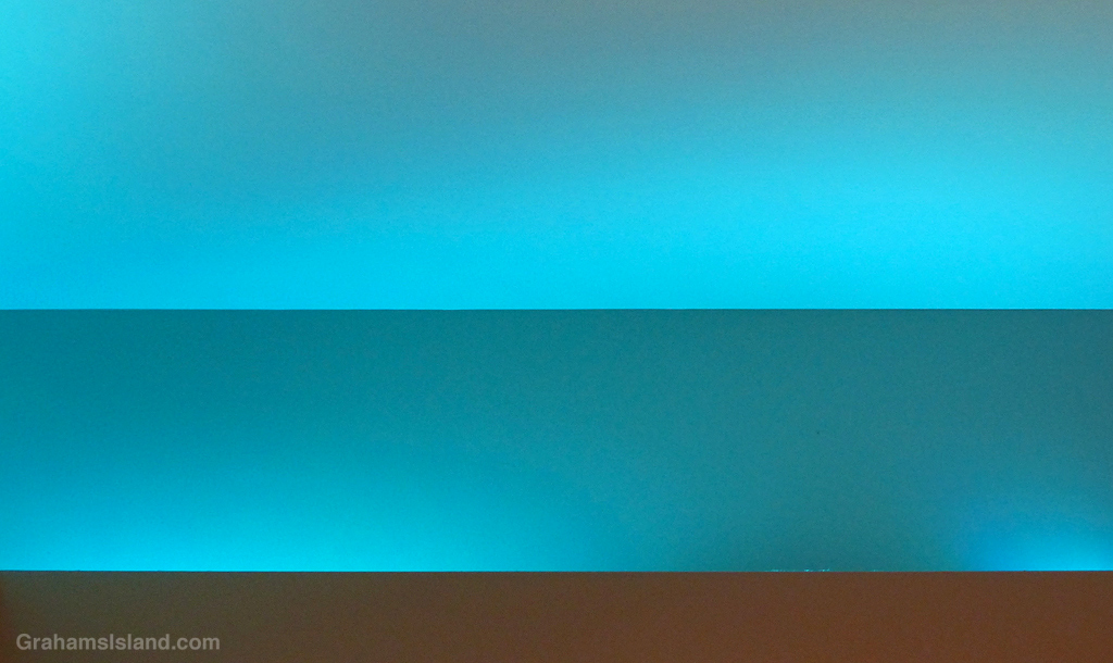 Blue lights illuminate a ceiling