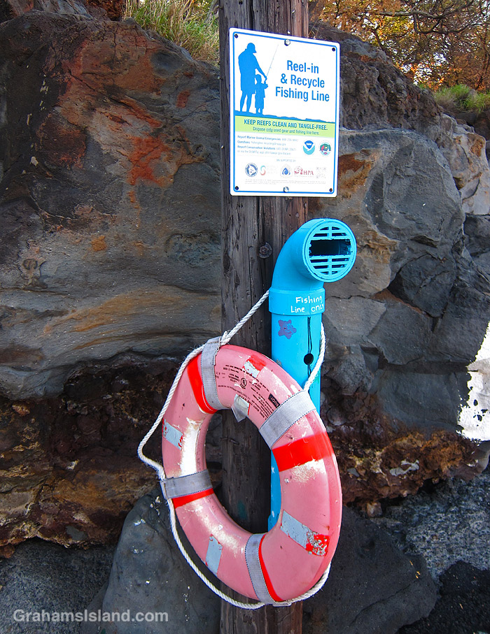 A sign encouraging the collection of fishing line salvaged from the water in Hawaii