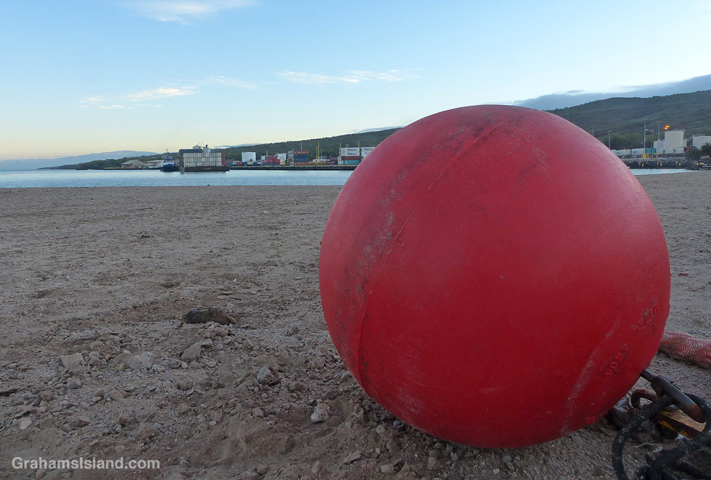 A red buoy on a beach in Hawaii