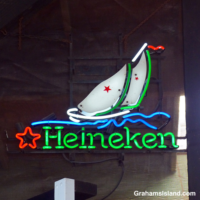 A neon sign advertising Heineken Beer