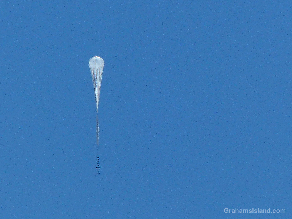 A scientific balloon rises over the Big Island, Hawaii