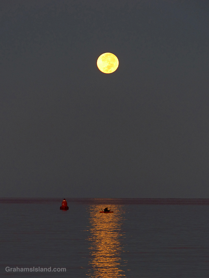 A full moon sets in Hawaii
