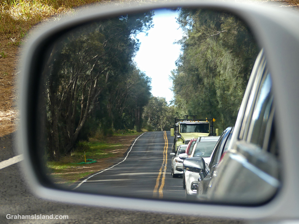 A line of traffic waits on a road in Hawaii