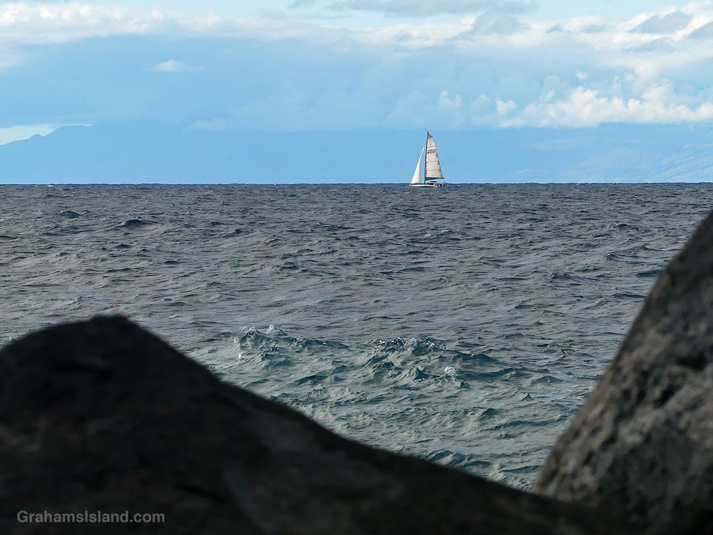 A sailboat in the ʻAlenuihāhā Channel between Maui and the Big Island Hawaii