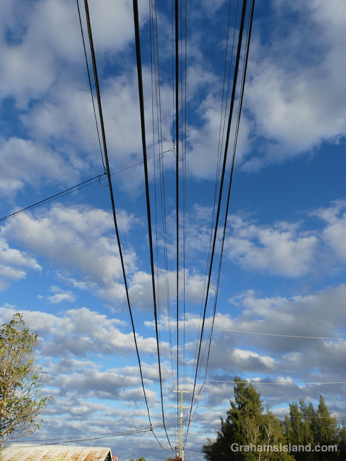 Power lines against a blue sky in Hawaii