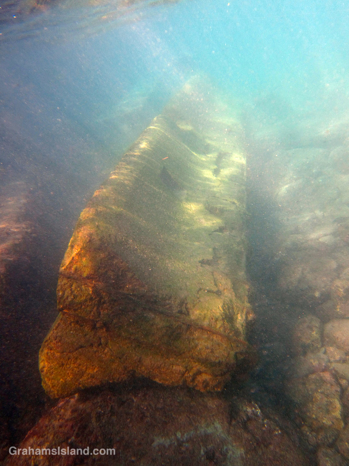 A concrete barrier in the water at Mahukona Hawaii