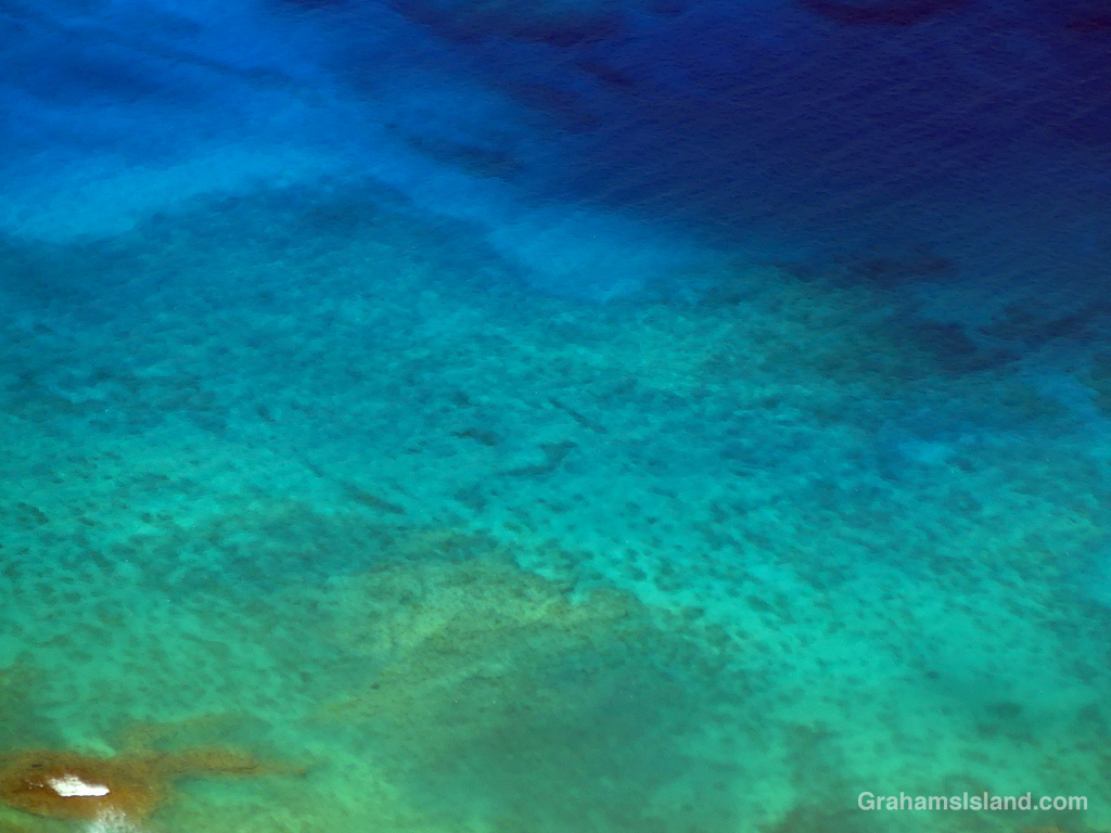 A view of the ocean off Maui taken from the air.