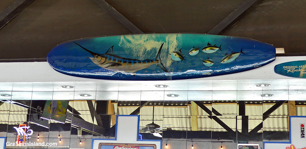 A painted surfboard at the Harbor House Restaurant in Kailua Kona, Hawaii