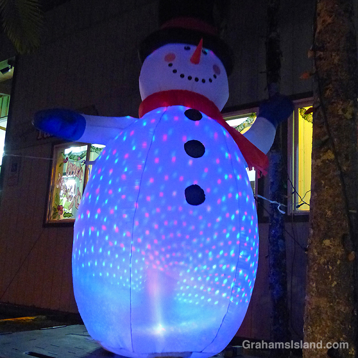 An inflatable snowman outside a store in Hawaii