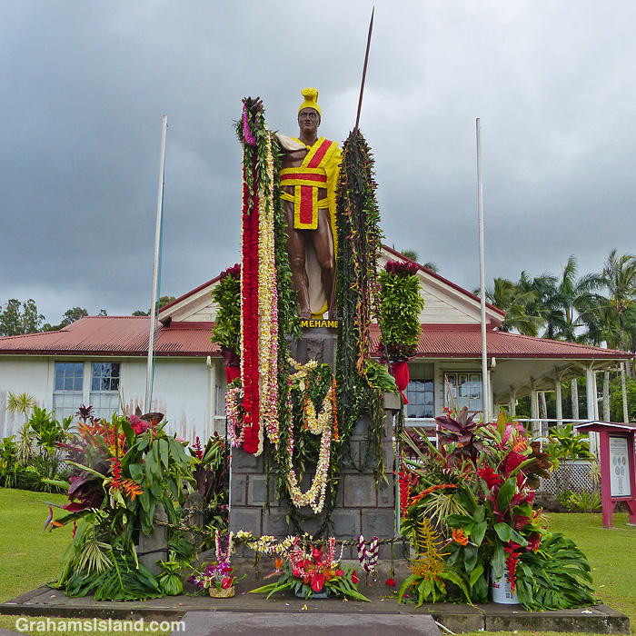 The statue of King Kamehameha in Kapaau, Hawaii, adorned with leis