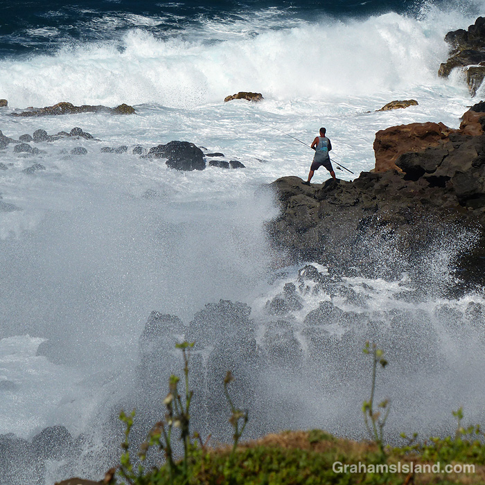 A fisherman waits on the North Kohala coast