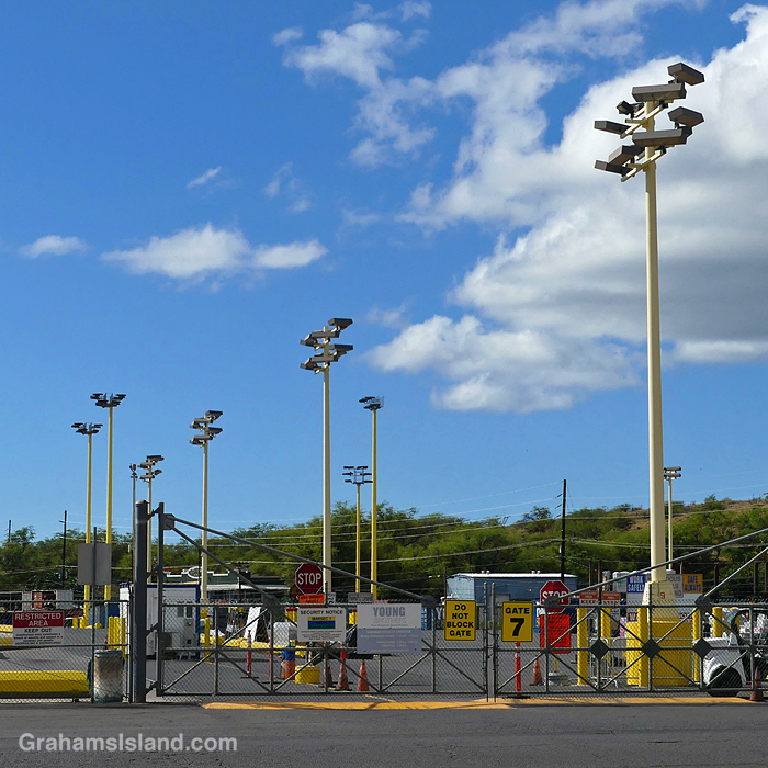 Light standards by a gate at the port of Kawaihae, Hawaii