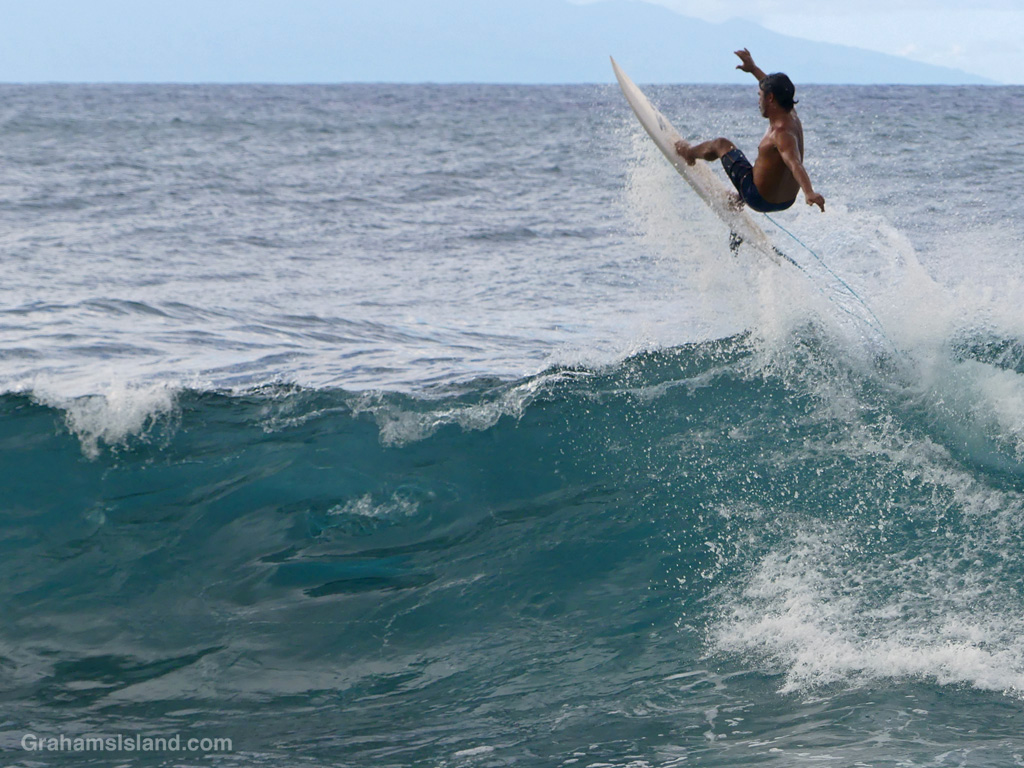 A surfer off Keokea Beach Park, Hawaii