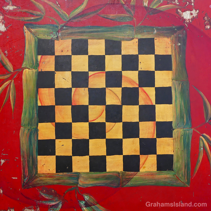 A colorful table with a chess board motif in Hawaii