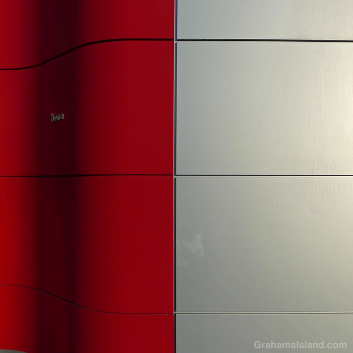 Red and silver panels on an exterior wall in Hawaii