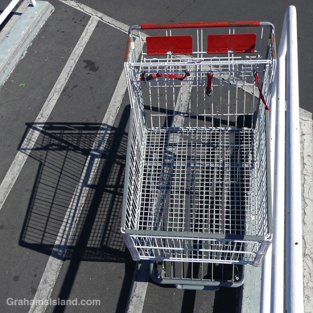 A shopping cart and shadow in Kailua Kona, Hawaii
