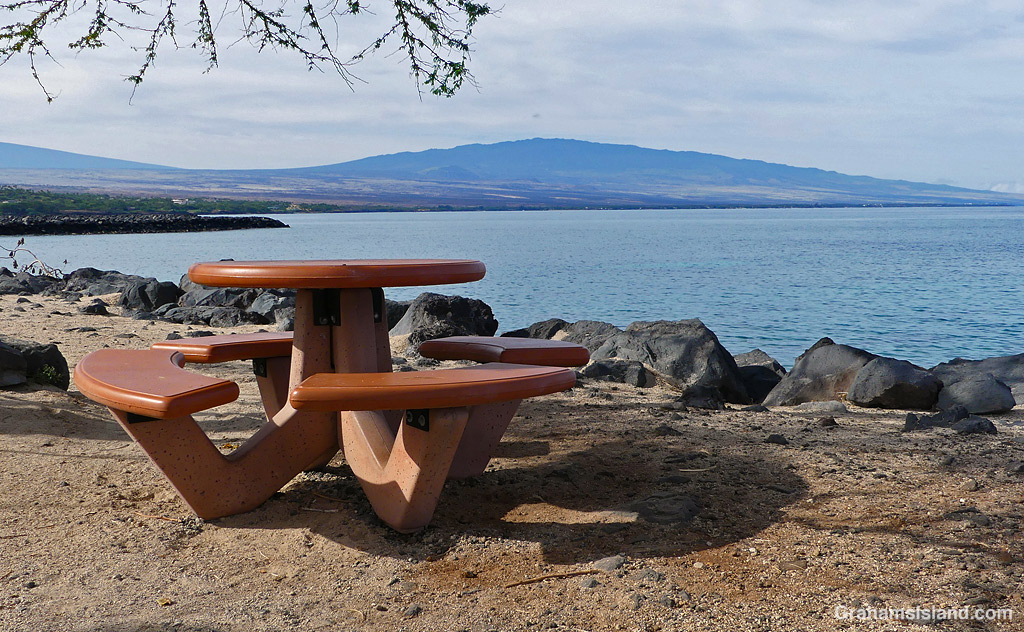 A Bench at Kawaihae Harbor with a view of Hualalai in Hawaii