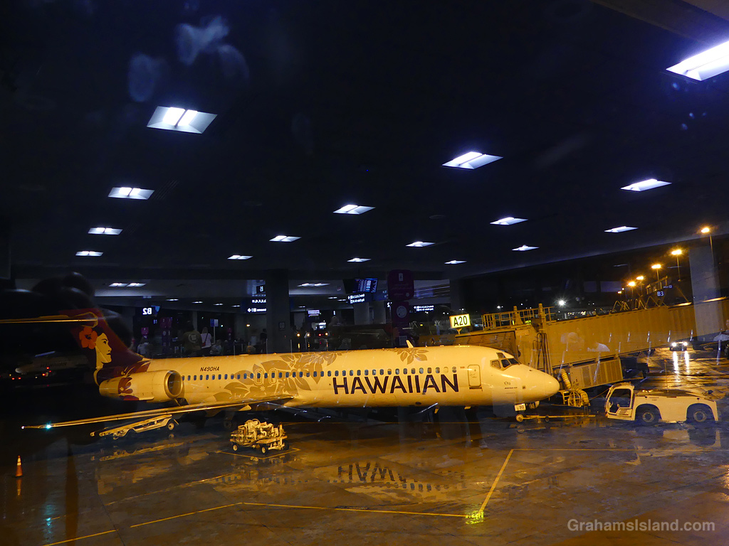 Reflections and a plane at Honolulu airport in Hawaii