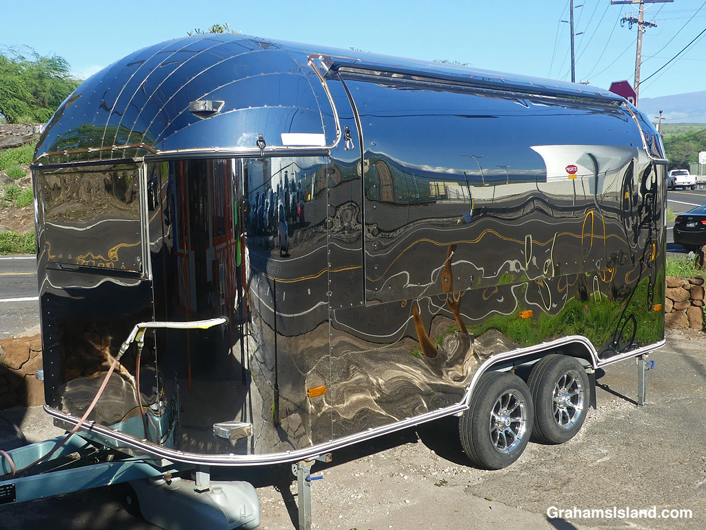 Reflections on a shiny Airstream trailer in Kawaihae, Hawaii