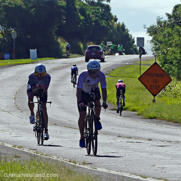 Cyclists in the 2026 Ironman 70.3 race in Hawaii, riding to and from Hawi.