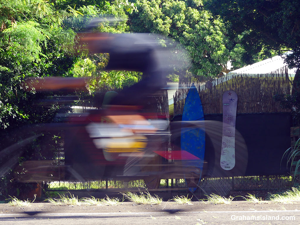 A cyclist in the 2026 Ironman 70.3 race in Hawaii, zips away from Hawi.