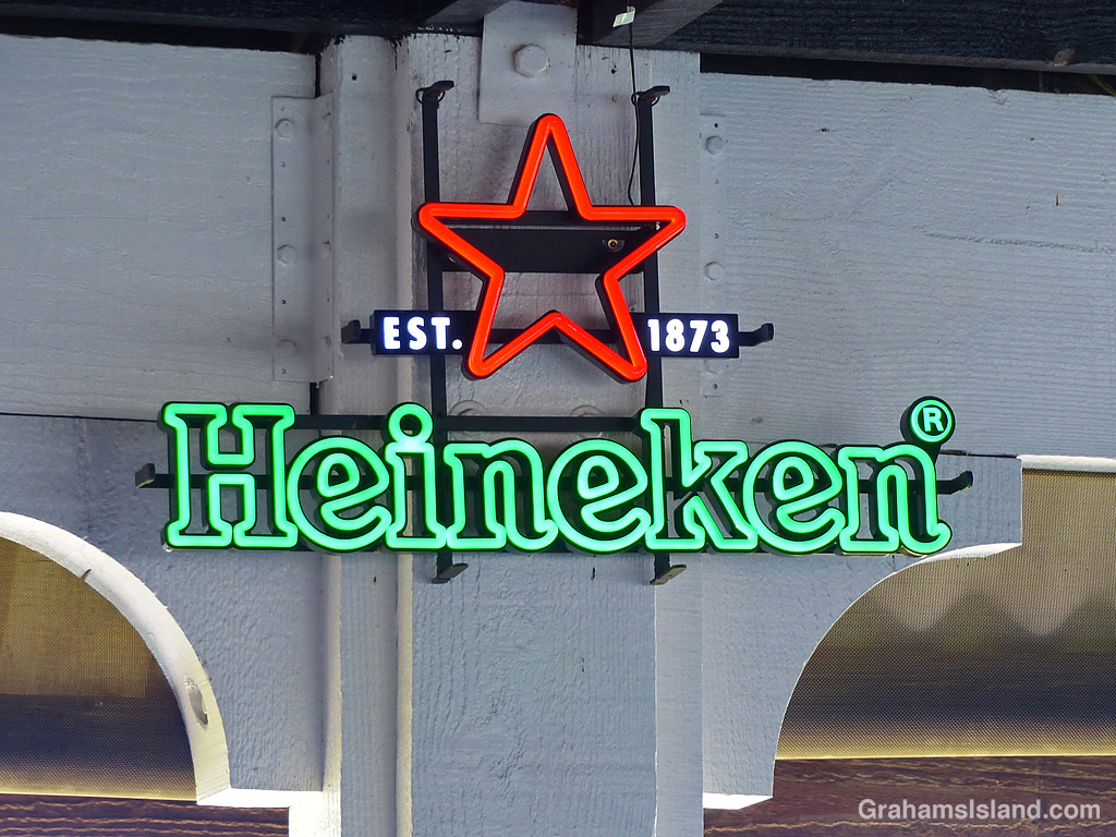A neon Heineken sign in a restaurant in Kailua Kona, Hawaii