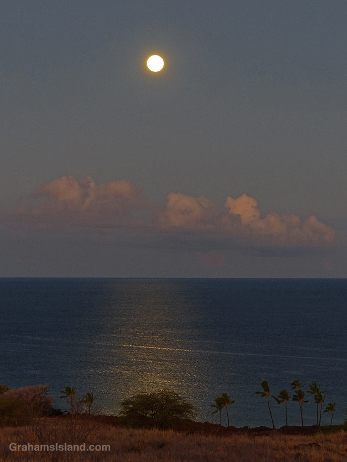 A Full moon setting off the Kohala Coast in Hawaii